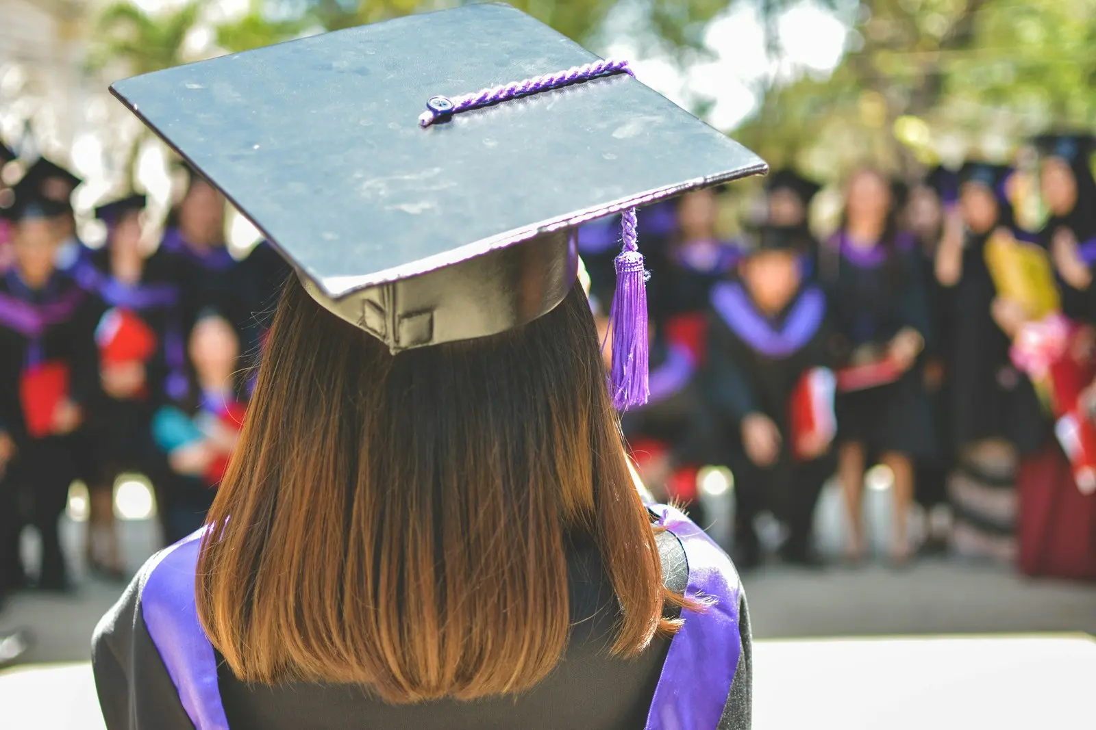 A graduate in cap and gown at a graduation ceremony